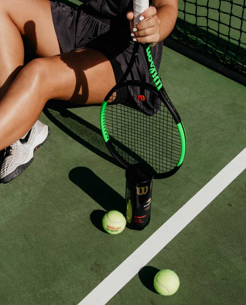 woman playing tennis after PRP injections in the Bay Area and Oakland